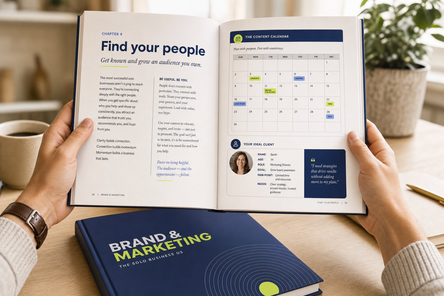 The Brand & Marketing OS playbook held open to the Find Your People chapter, showing a content calendar and an ideal-client persona card